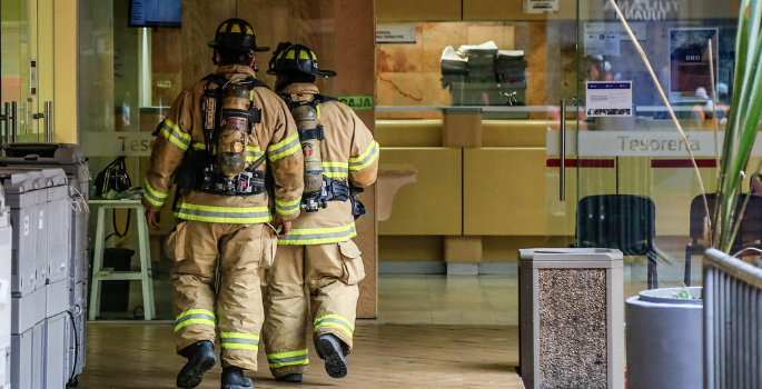 2 Firefighters inspecting a building