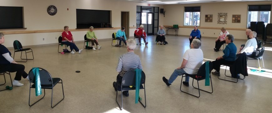 seniors doing chair exercises 